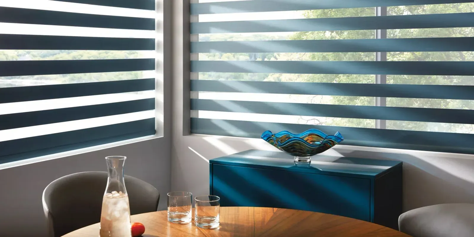 Navy designer banded shades in a modern dining nook