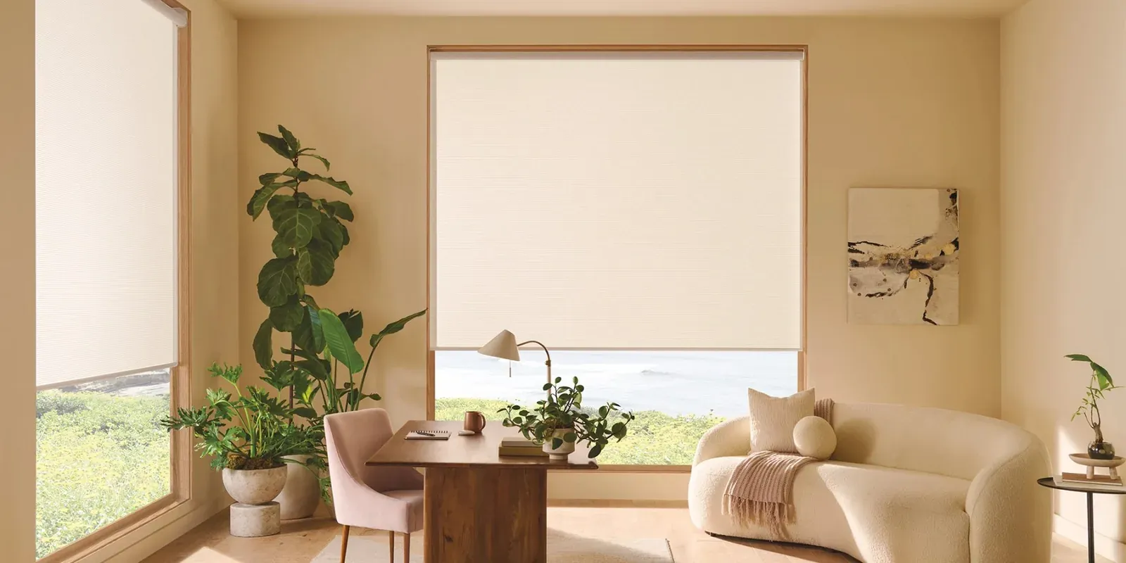 Designer roller shade in a warm, neutral living room