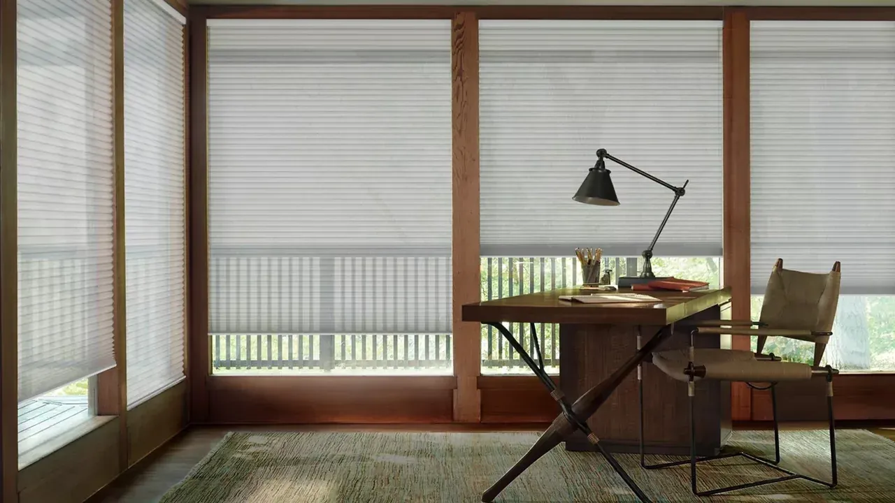 Duette honeycomb shades on large windows in a home office