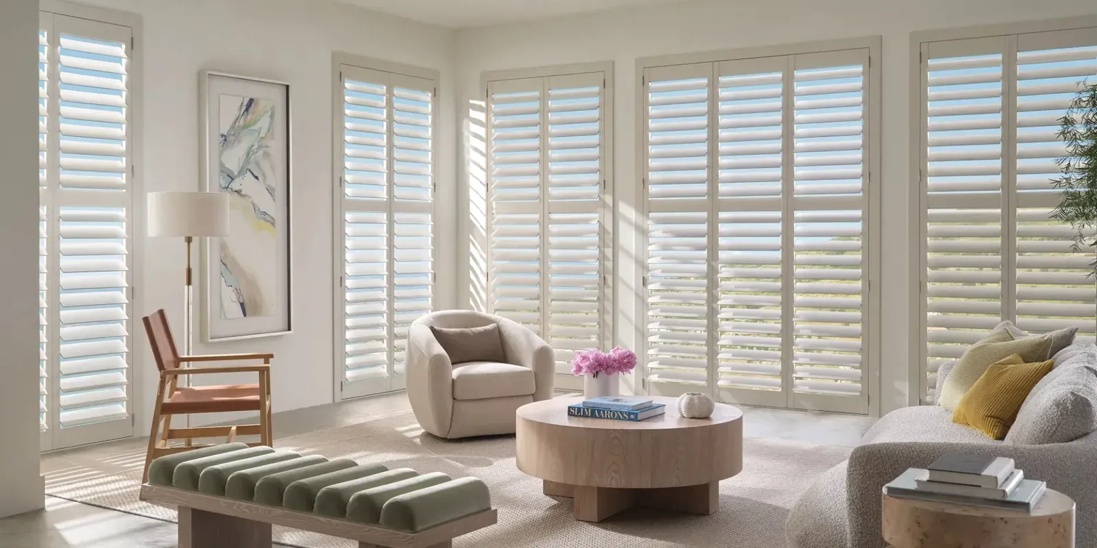 White Heritance hardwood shutters in a bright living room