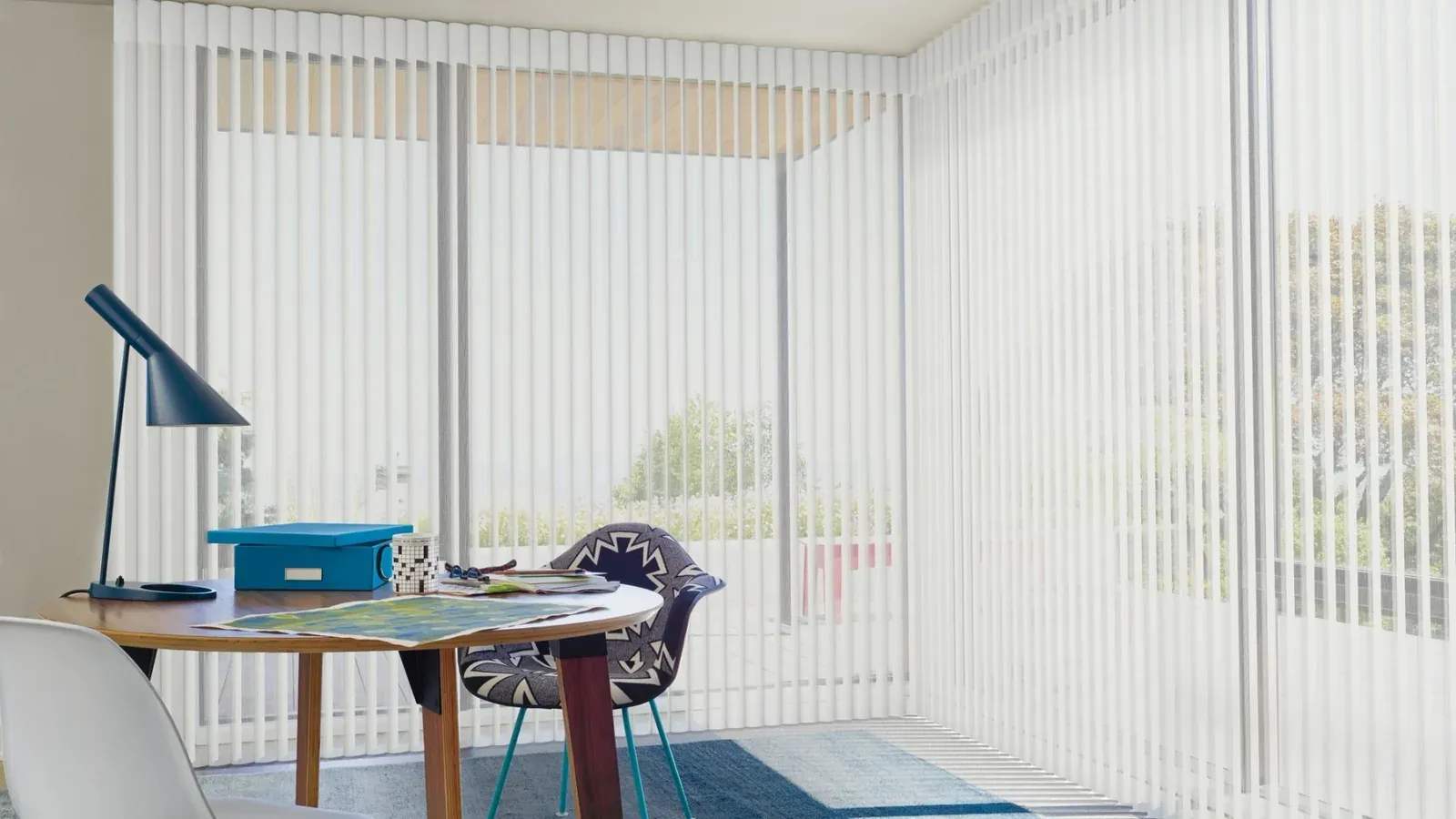Luminette vertical sheer panels across tall windows in a home office