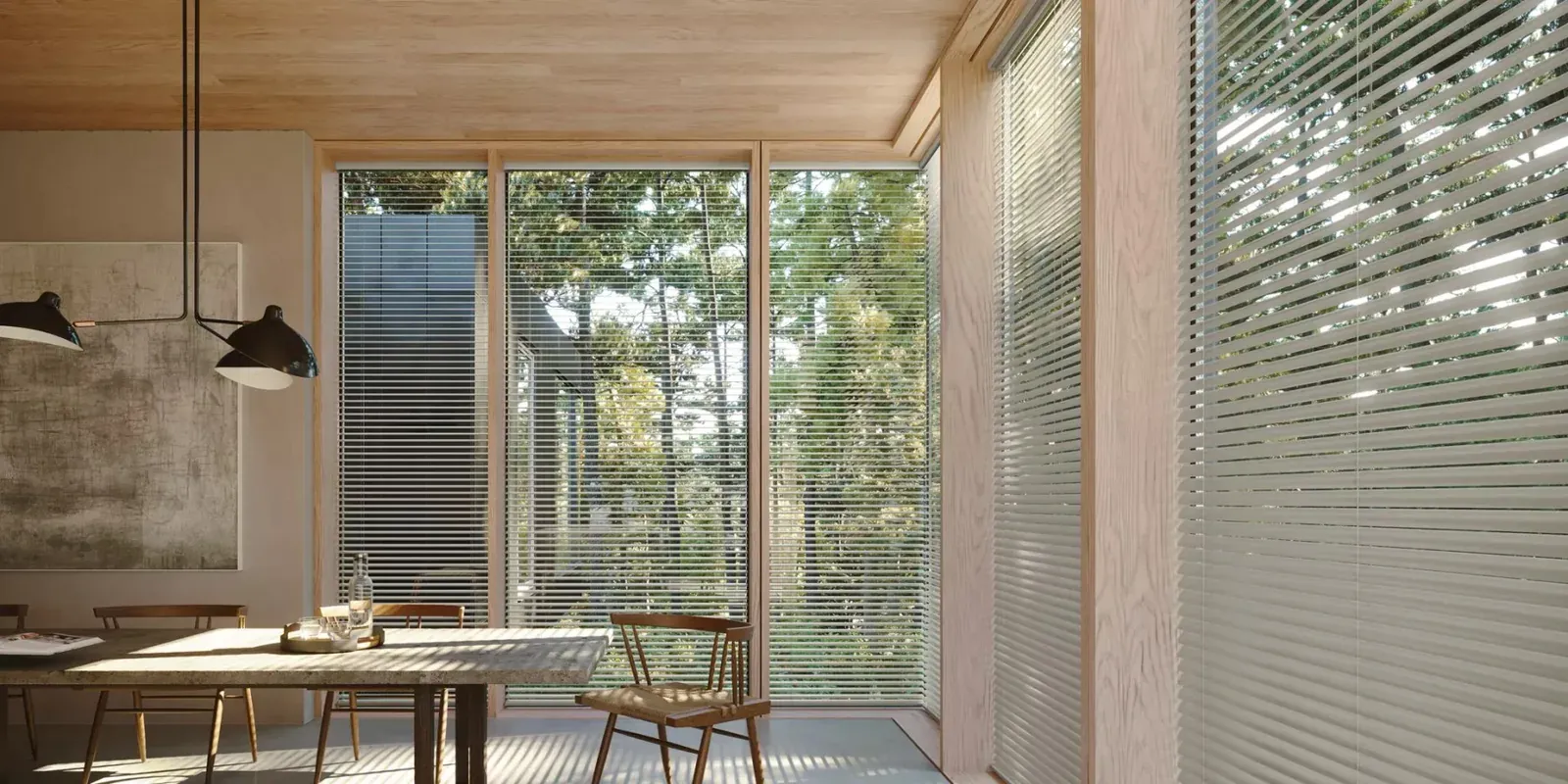 Metal mini blinds in a modern dining area with tall windows