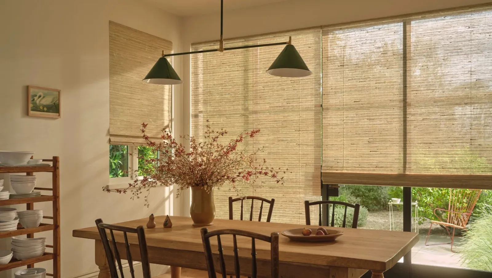 Woven wood shades with PowerView automation in a sunlit dining room